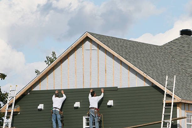 Professional Storm Damage Siding Repair technician working in Moores Hill, IN
